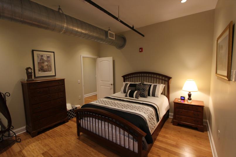 Cozy bedroom with wooden furniture