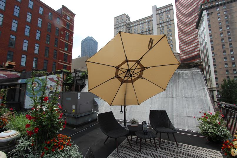 Rooftop seating with umbrella