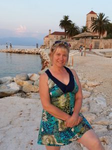 Smiling woman by the shore