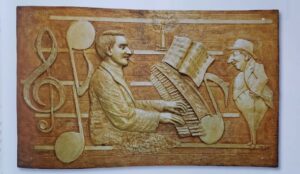 Musicians playing piano relief art